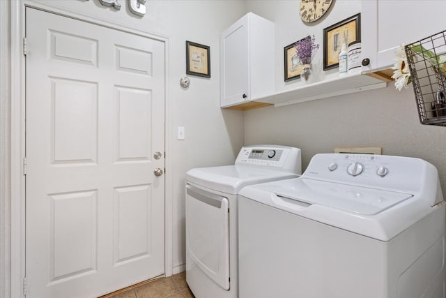 10285 Peony Ln, Waco, TX 76708 - laundry room featuring cabinet space, independent washer and dryer, and light tile patterned flooring