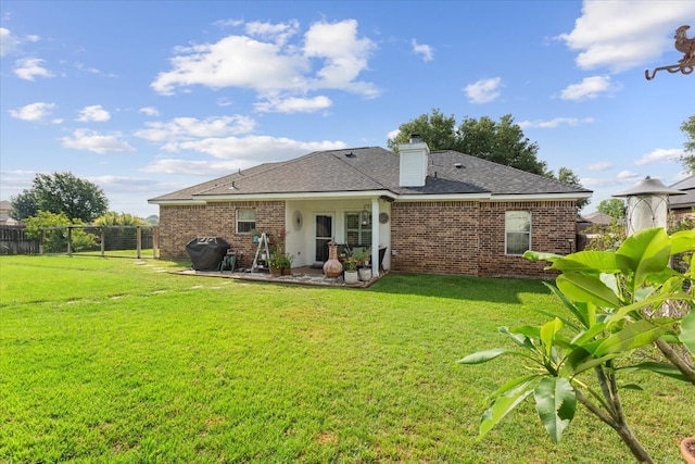 10285 Peony Ln, Waco, TX 76708 - rear view of house with brick siding, a patio area, a chimney, and a shingled roof