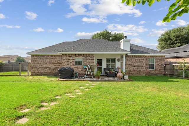 10285 Peony Ln, Waco, TX 76708 - rear view of house featuring brick siding, a patio area, roof with shingles, and a chimney