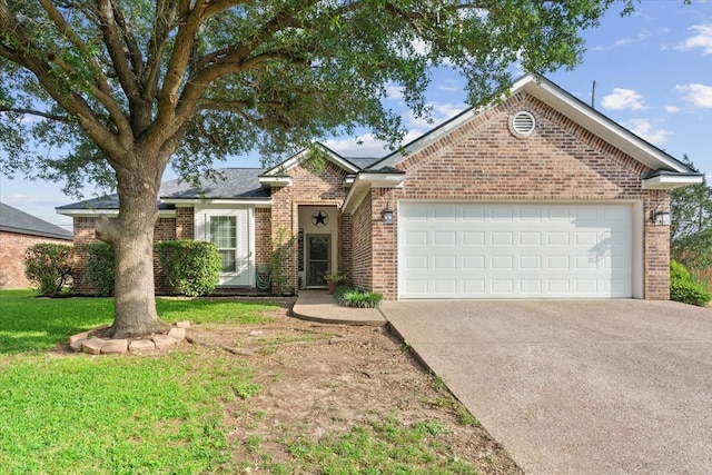 10285 Peony Ln, Waco, TX 76708 - view of front facade with brick siding, an attached garage, concrete driveway, and a front lawn