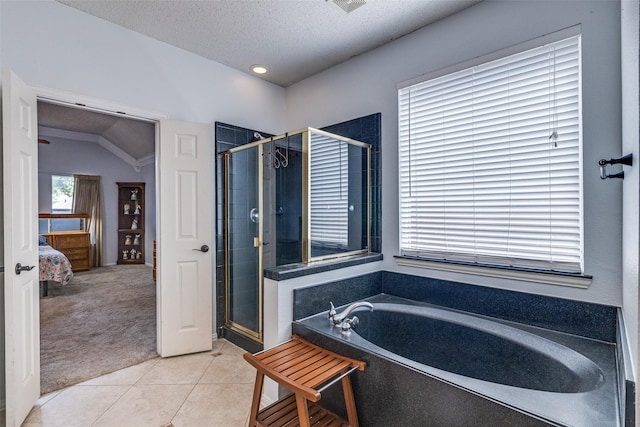 1109 Huntington Trl, Mansfield, TX 76063 - ensuite bathroom featuring a garden tub, a shower stall, tile patterned floors, and a textured ceiling