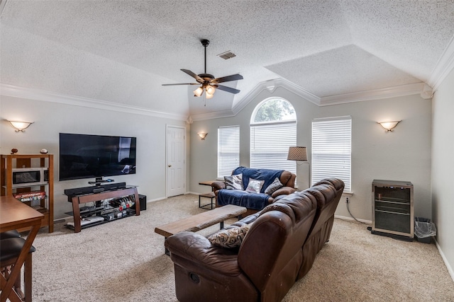 1109 Huntington Trl, Mansfield, TX 76063 - living room with light carpet, lofted ceiling, ceiling fan, baseboards, and ornamental molding