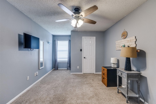 1109 Huntington Trl, Mansfield, TX 76063 - office area featuring a ceiling fan, a textured ceiling, light colored carpet, and baseboards