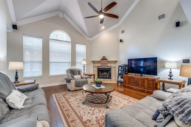 1109 Huntington Trl, Mansfield, TX 76063 - living room with a ceiling fan, wood finished floors, a premium fireplace, baseboards, and high vaulted ceiling