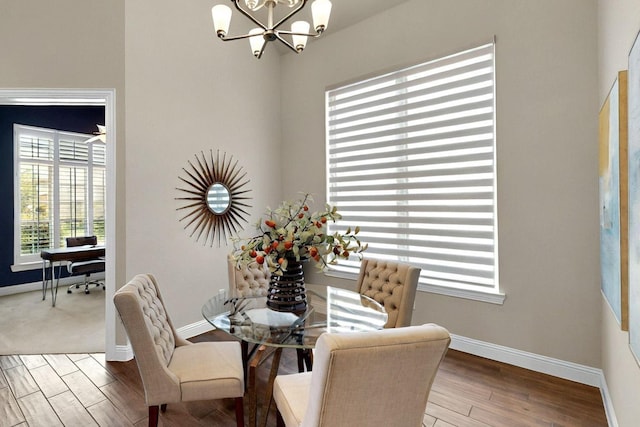 12164 Curry Creek Dr, Frisco, TX 75035 - dining space featuring a chandelier, baseboards, and wood finished floors