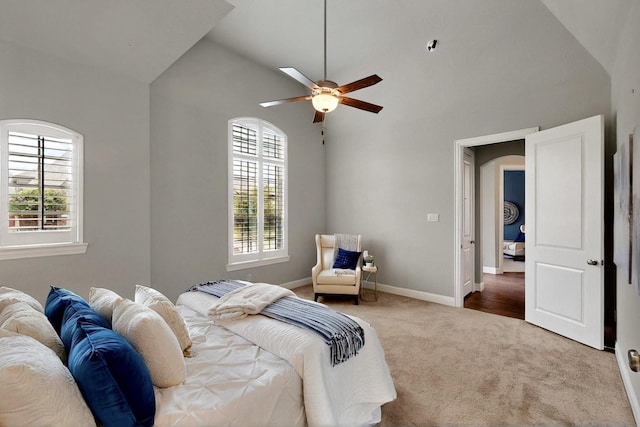 12164 Curry Creek Dr, Frisco, TX 75035 - bedroom featuring carpet, baseboards, arched walkways, high vaulted ceiling, and ceiling fan