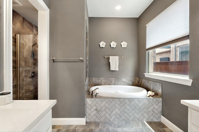 12164 Curry Creek Dr, Frisco, TX 75035 - full bathroom featuring a shower stall, a bath, vanity, baseboards, and tile patterned flooring