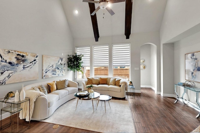 12164 Curry Creek Dr, Frisco, TX 75035 - living room featuring arched walkways, ceiling fan, high vaulted ceiling, dark wood-type flooring, and baseboards