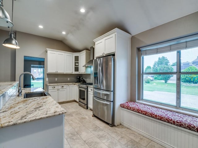 605 Lakeridge Dr, Lavon, TX 75166 - kitchen with appliances with stainless steel finishes, a sink, wall chimney exhaust hood, vaulted ceiling, and white cabinets