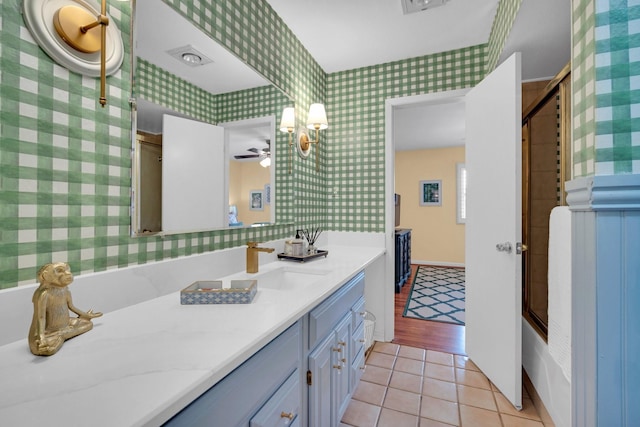 12327 Band Box Pl, Dallas, TX 75244 - full bath featuring wallpapered walls, ceiling fan, tile patterned flooring, baseboards, and vanity