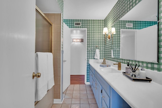 12327 Band Box Pl, Dallas, TX 75244 - full bath featuring vanity, tile patterned floors, an enclosed shower, wallpapered walls, and baseboards