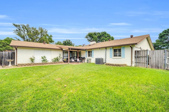 12327 Band Box Pl, Dallas, TX 75244 - back of property with cooling unit, a patio, brick siding, and a chimney