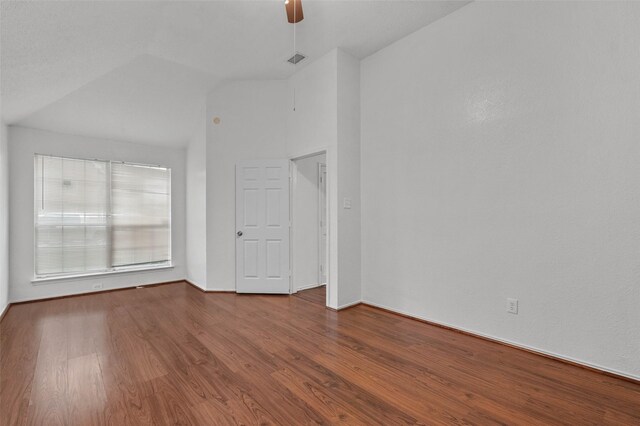 2323 Weatherby Dr, Mesquite, TX 75181 - spare room featuring vaulted ceiling, wood finished floors, a ceiling fan, and baseboards