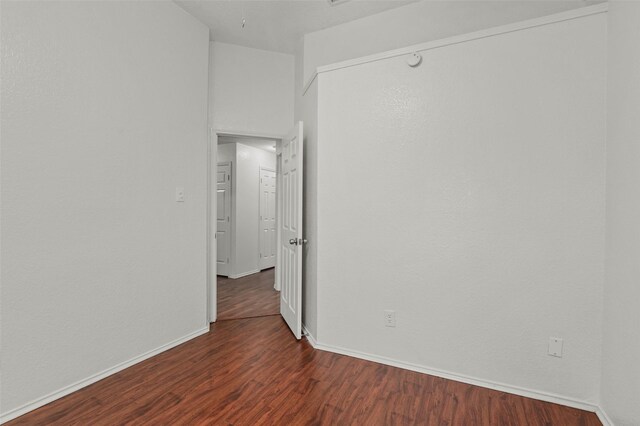 2323 Weatherby Dr, Mesquite, TX 75181 - unfurnished room with dark wood-style flooring and baseboards
