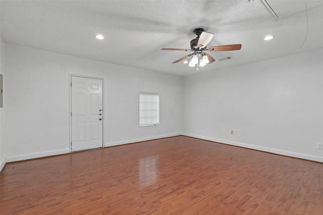 2323 Weatherby Dr, Mesquite, TX 75181 - empty room featuring attic access, wood finished floors, recessed lighting, ceiling fan, and baseboards