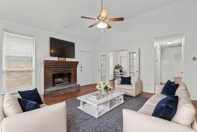 2323 Weatherby Dr, Mesquite, TX 75181 - living room with wood finished floors, ceiling fan, lofted ceiling, and a fireplace