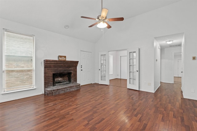 2323 Weatherby Dr, Mesquite, TX 75181 - unfurnished living room featuring wood finished floors, ceiling fan, plenty of natural light, a fireplace, and high vaulted ceiling