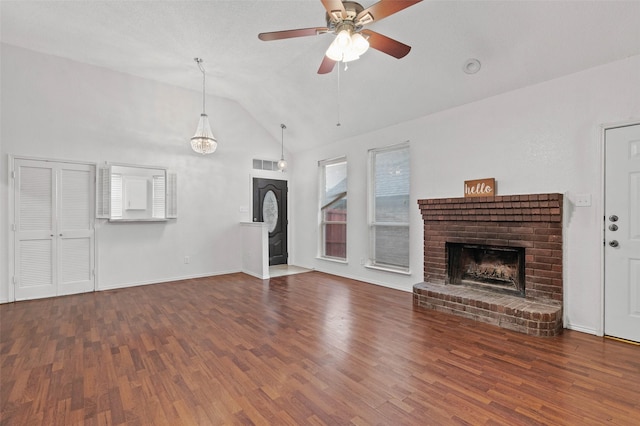 2323 Weatherby Dr, Mesquite, TX 75181 - unfurnished living room featuring lofted ceiling, wood finished floors, a fireplace, a ceiling fan, and baseboards