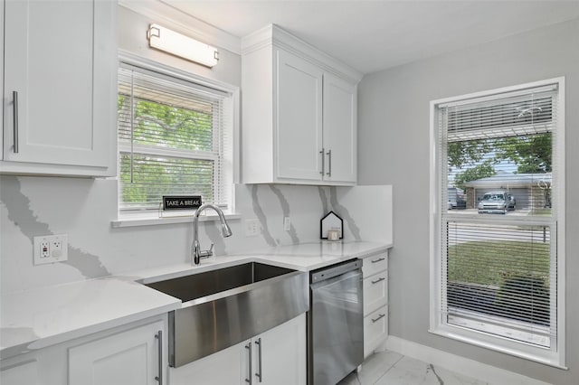 1632 Pecan Park Dr, Arlington, TX 76012 - kitchen with dishwasher, a sink, light marble finish floors, white cabinetry, and baseboards