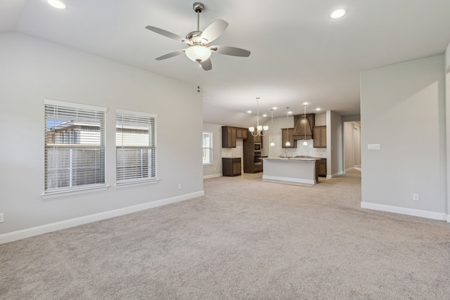 548 Bradley Dr, Fate, TX 75087 - unfurnished living room featuring recessed lighting, light colored carpet, ceiling fan, baseboards, and vaulted ceiling