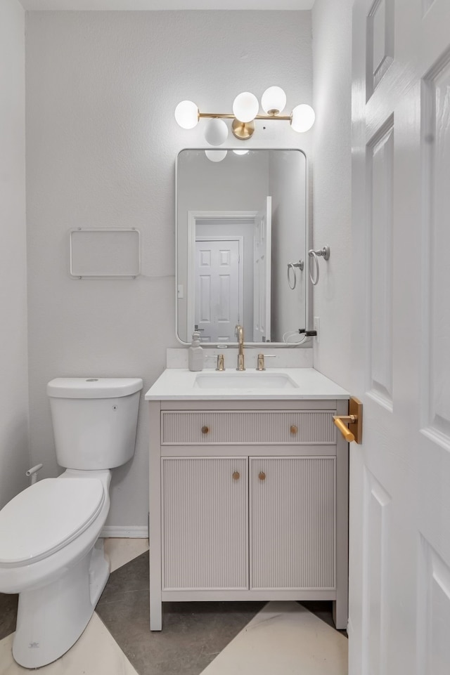10721 Emerald Park Ln, Fort Worth, TX 76052 - bathroom featuring toilet, vanity, and baseboards