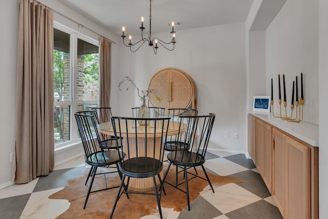 10721 Emerald Park Ln, Fort Worth, TX 76052 - dining area featuring a chandelier, light flooring, and baseboards