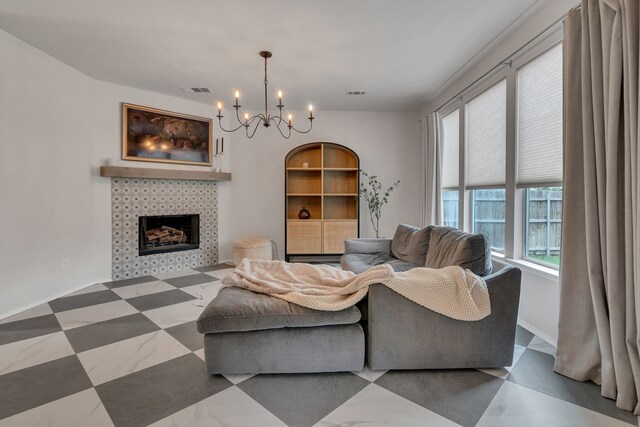 10721 Emerald Park Ln, Fort Worth, TX 76052 - living area featuring a chandelier and a tiled fireplace