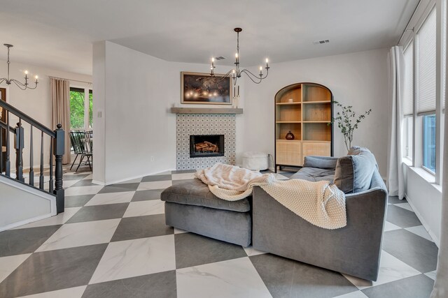 10721 Emerald Park Ln, Fort Worth, TX 76052 - living area with a chandelier, a fireplace, and stairway