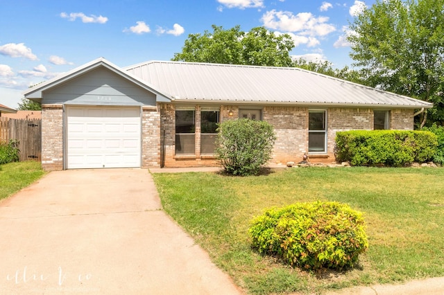 3718 Radcliff Rd, Abilene, TX 79602 - ranch-style home with brick siding, a garage, concrete driveway, and metal roof