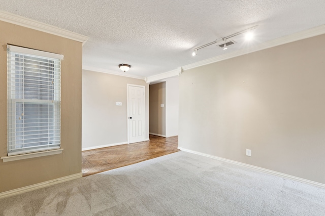 15741 Mapleview Cir, Dallas, TX 75248 - spare room featuring ornamental molding, carpet floors, a textured ceiling, baseboards, and track lighting