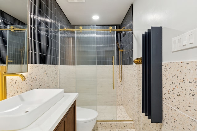 15741 Mapleview Cir, Dallas, TX 75248 - full bathroom featuring a shower stall, tile walls, vanity, and toilet