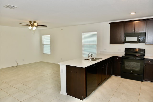 5532 Timber Point Dr, Princeton, TX 75407 - kitchen with black appliances, a sink, light tile patterned floors, light countertops, and a peninsula