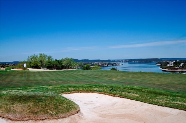 101 Eagle Pt, Graford, TX 76449 - view of green lawn with a water view and a putting area