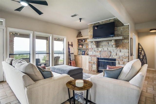 101 Eagle Pt, Graford, TX 76449 - living area with ceiling fan and a fireplace
