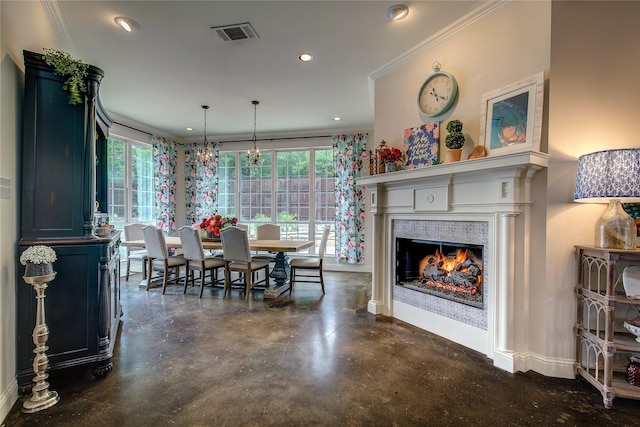 1116 Squaw Vly, Rockwall, TX 75087 - dining room featuring concrete floors, recessed lighting, a lit fireplace, crown molding, and baseboards
