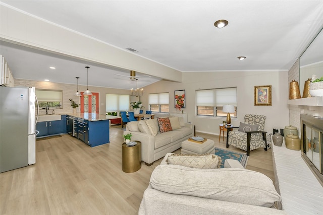 3904 Crescent Dr, De Cordova, TX 76049 - living area featuring light wood-style floors, a fireplace, and baseboards