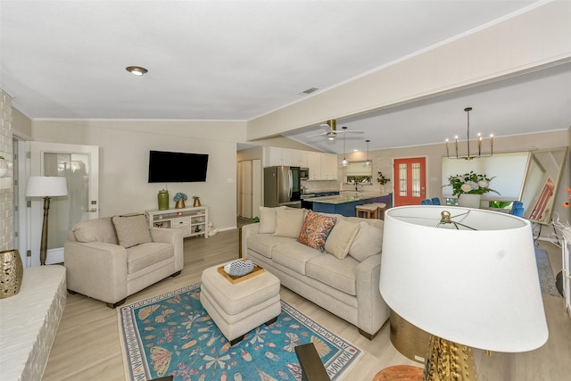 3904 Crescent Dr, De Cordova, TX 76049 - living area with light wood-style flooring, vaulted ceiling, baseboards, a chandelier, and a ceiling fan