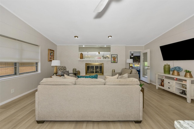 3904 Crescent Dr, De Cordova, TX 76049 - living room with lofted ceiling, light wood finished floors, crown molding, baseboards, and a ceiling fan