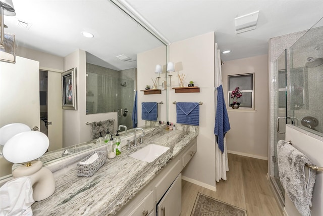 3904 Crescent Dr, De Cordova, TX 76049 - full bathroom featuring a shower stall, wood finished floors, baseboards, vanity, and recessed lighting