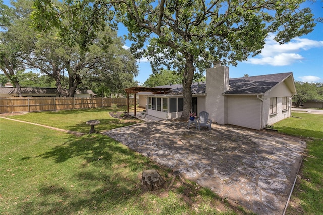 3904 Crescent Dr, De Cordova, TX 76049 - rear view of property with a sunroom, a patio, a chimney, and roof with shingles
