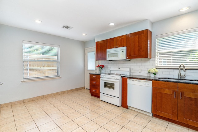 8830 Boundbrook Ave, Dallas, TX 75243 - kitchen featuring white appliances, a sink, decorative backsplash, brown cabinetry, and recessed lighting