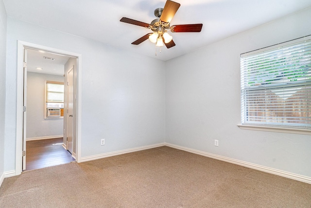 8830 Boundbrook Ave, Dallas, TX 75243 - carpeted spare room with ceiling fan, baseboards, and cooling unit
