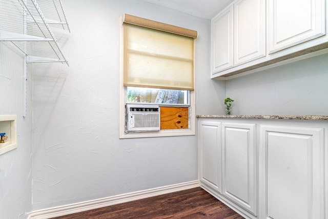 8830 Boundbrook Ave, Dallas, TX 75243 - laundry area featuring dark wood-style flooring, washer hookup, baseboards, and cooling unit