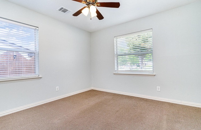 8830 Boundbrook Ave, Dallas, TX 75243 - spare room featuring carpet, a ceiling fan, and baseboards