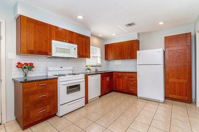 8830 Boundbrook Ave, Dallas, TX 75243 - kitchen with white appliances, a sink, tasteful backsplash, recessed lighting, and light tile patterned flooring