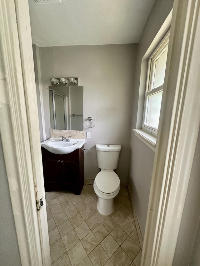 2952 Eric Ln, Farmers Branch, TX 75234 - bathroom featuring vanity, tile patterned flooring, toilet, and baseboards