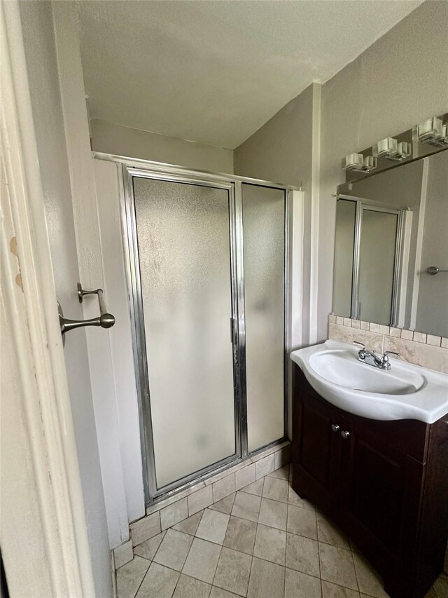 2952 Eric Ln, Farmers Branch, TX 75234 - bathroom with a stall shower, vanity, and tile patterned floors