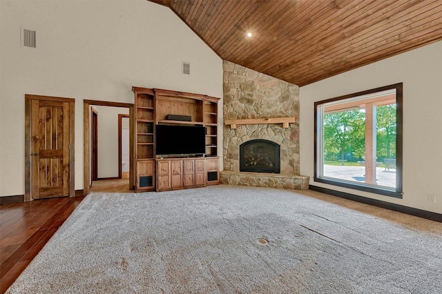 5300 Highland Dr, Denison, TX 75020 - unfurnished living room with wood ceiling, high vaulted ceiling, a fireplace, baseboards, and wood finished floors
