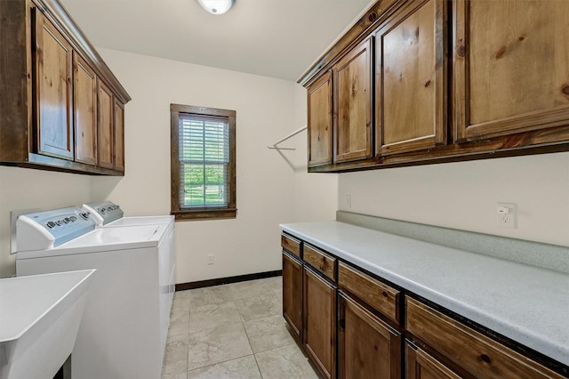 5300 Highland Dr, Denison, TX 75020 - washroom featuring cabinet space, independent washer and dryer, and baseboards