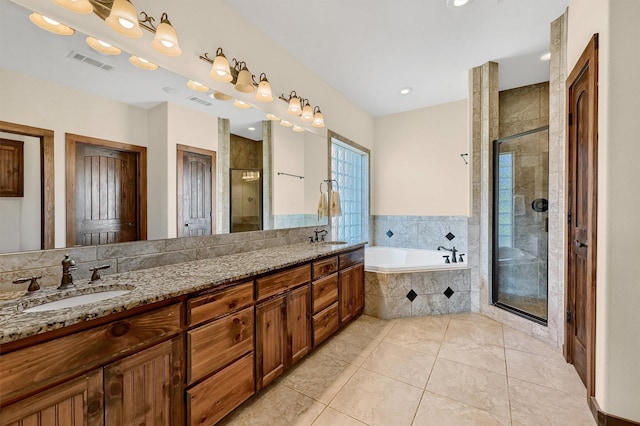 5300 Highland Dr, Denison, TX 75020 - full bath with a stall shower, a garden tub, double vanity, and tile patterned floors